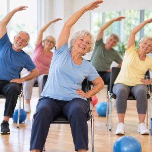seniors, exercise, fitness, chair yoga, senior health, summer, group workout, health fitness, senior program, active lifestyle, smiling faces, social interaction, nature, indoor environment, active seniors, group session, healthy aging, lifestyle, urban center, community center